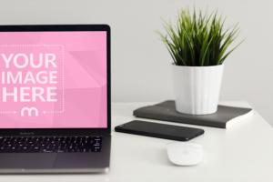 Macbook on Desk with Plant Mockup