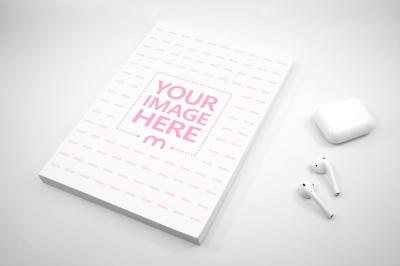 Paperback Book with Airpods Mockup