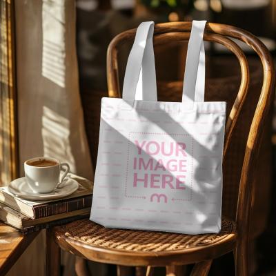 Tote Bag Mockup Hanging on a Chair in a Cafe Setting